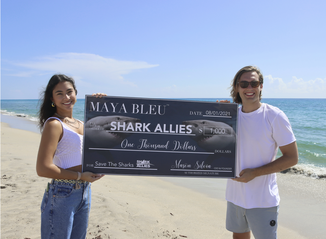 MAYA BLEU DONATES ONE THOUSAND DOLLARS TO SHARK ALLIES TO SAVE SHARKS.